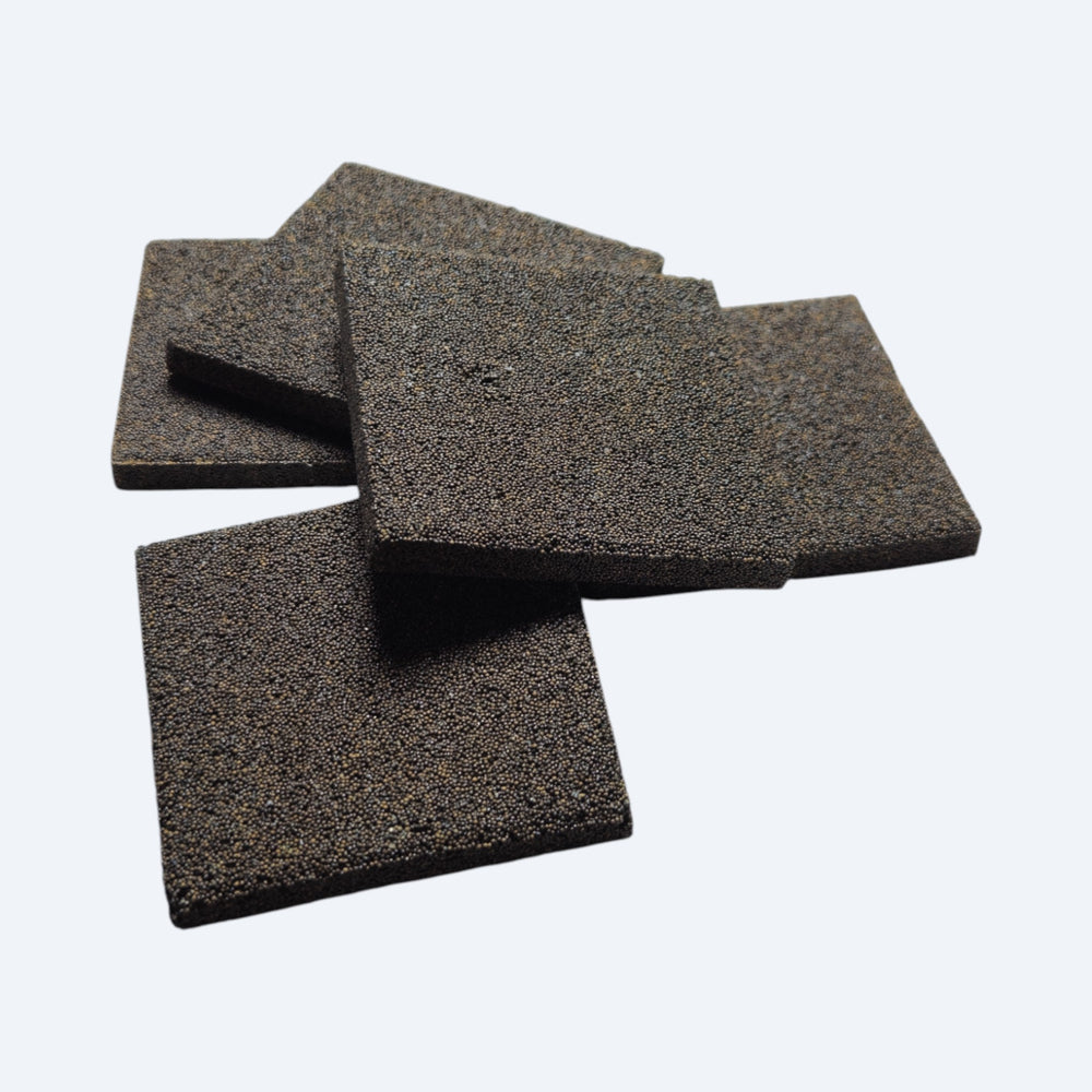 Four black square ceramic frag disc on a white background